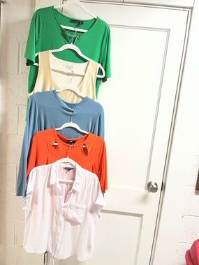 Lot of women’s tops. DKNY, Tahari etc. L/XL